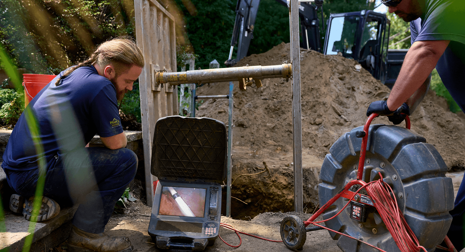 Tech inspecting sewer line