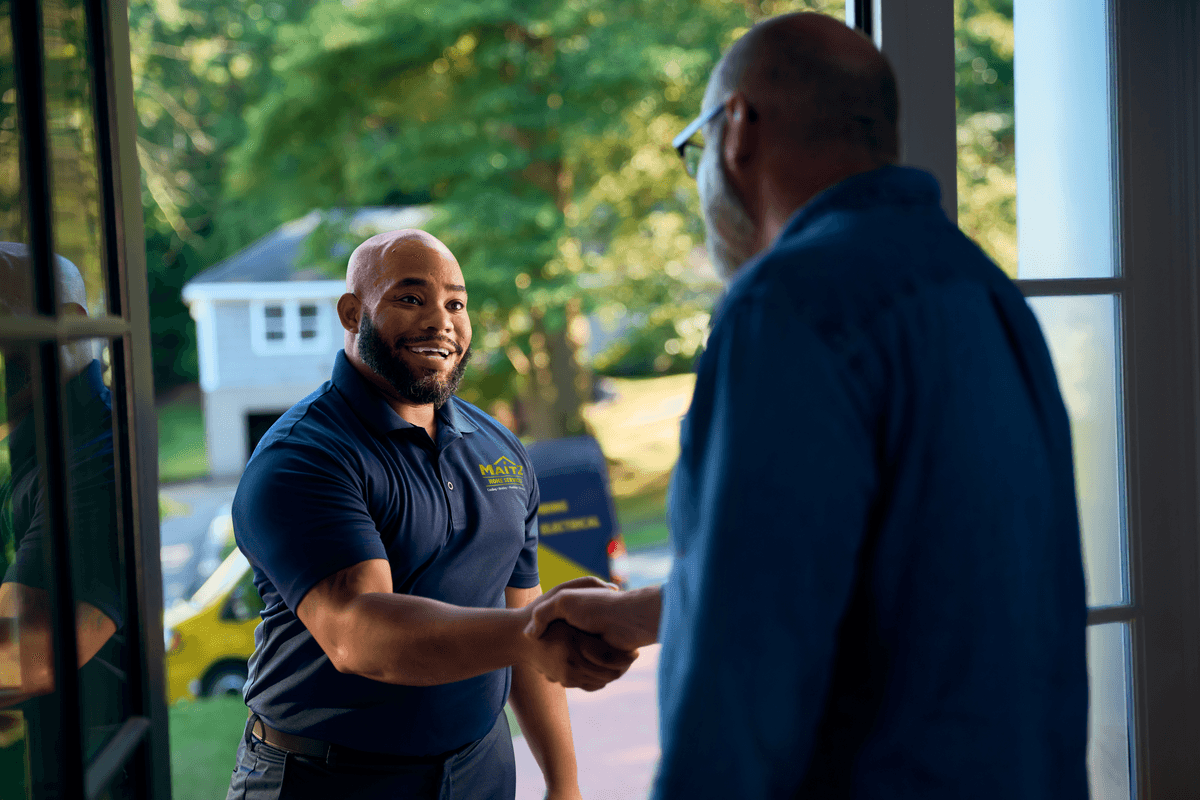 Technician shaking customers hand