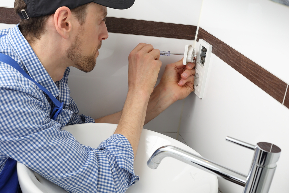 electrician installing outlet